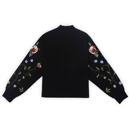 Front view of the beaded Charlie Denim Unisex Jacket Some examples of alt text are “Black 
denim jacket (unisex) has beaded embellishments on sleeves” and “Charlie denim jacket in black 
with intricate bead detailing.”