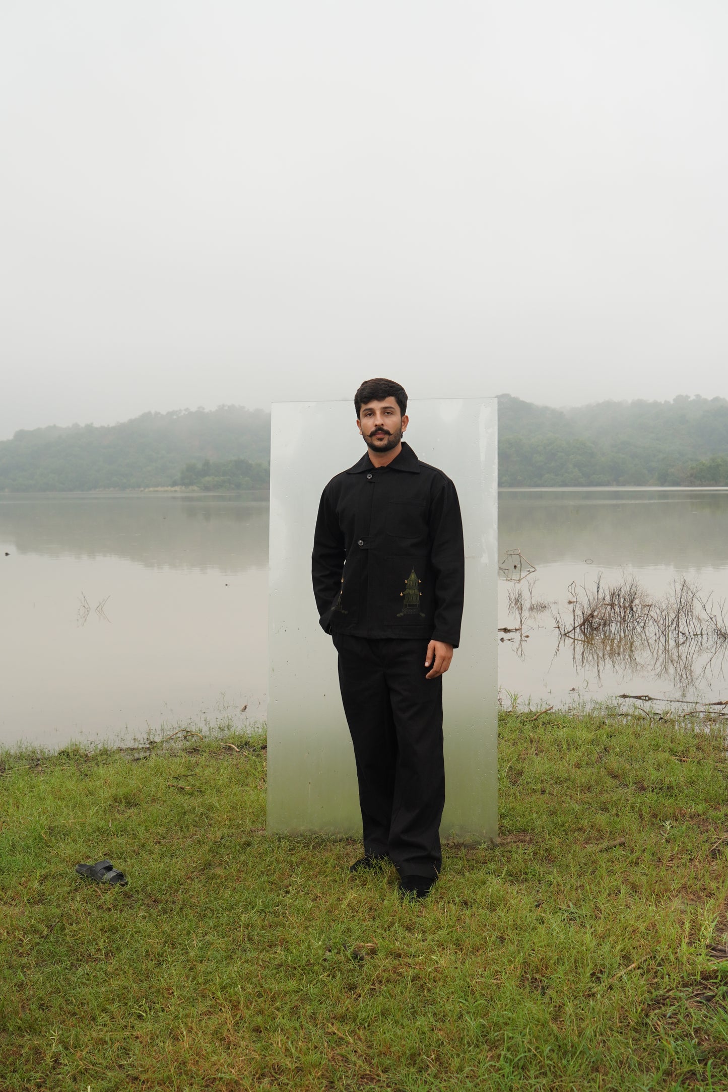 A black Beck Unisex Hand-Painted Jacket seen from the front. The alt texts say, "Unisex 
black cotton denim twill jacket with hand-painted artwork" and "Beck hand-painted 
jacket in black, featuring unique artwork." 
