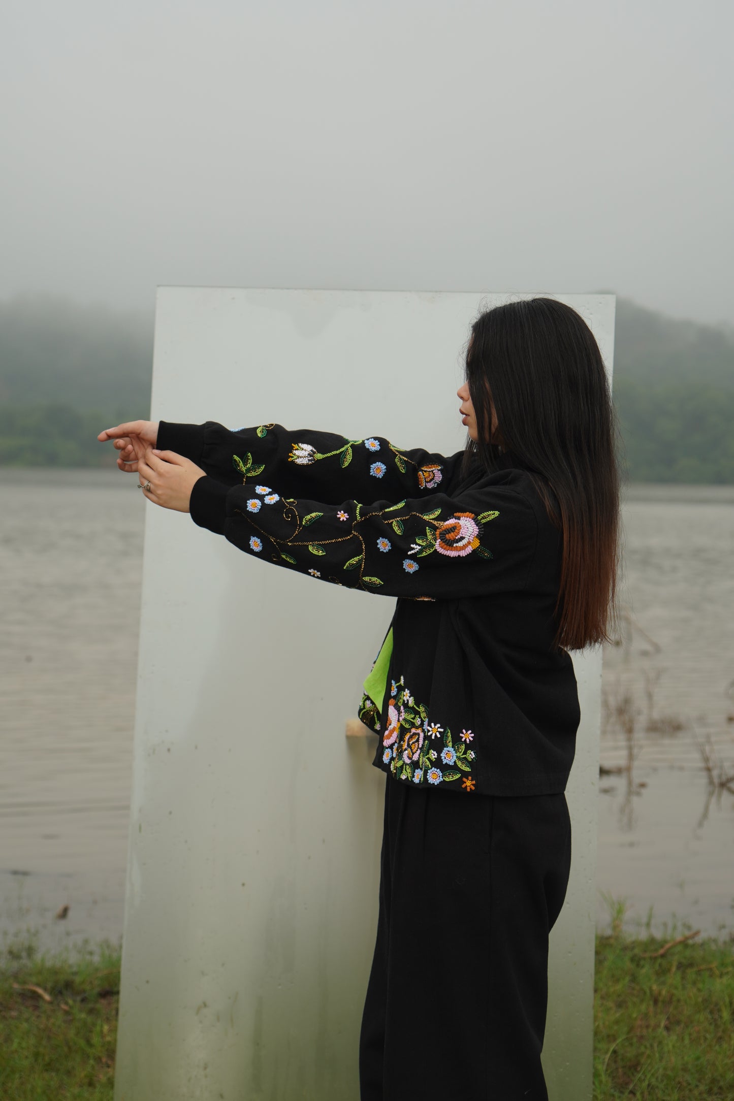 Front view of the beaded Charlie Denim Unisex Jacket Some examples of alt text are “Black 
denim jacket (unisex) has beaded embellishments on sleeves” and “Charlie denim jacket in black 
with intricate bead detailing.”