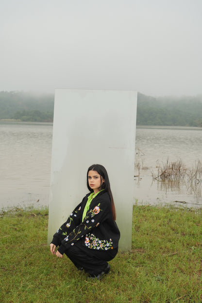 Front view of the beaded Charlie Denim Unisex Jacket Some examples of alt text are “Black 
denim jacket (unisex) has beaded embellishments on sleeves” and “Charlie denim jacket in black 
with intricate bead detailing.”