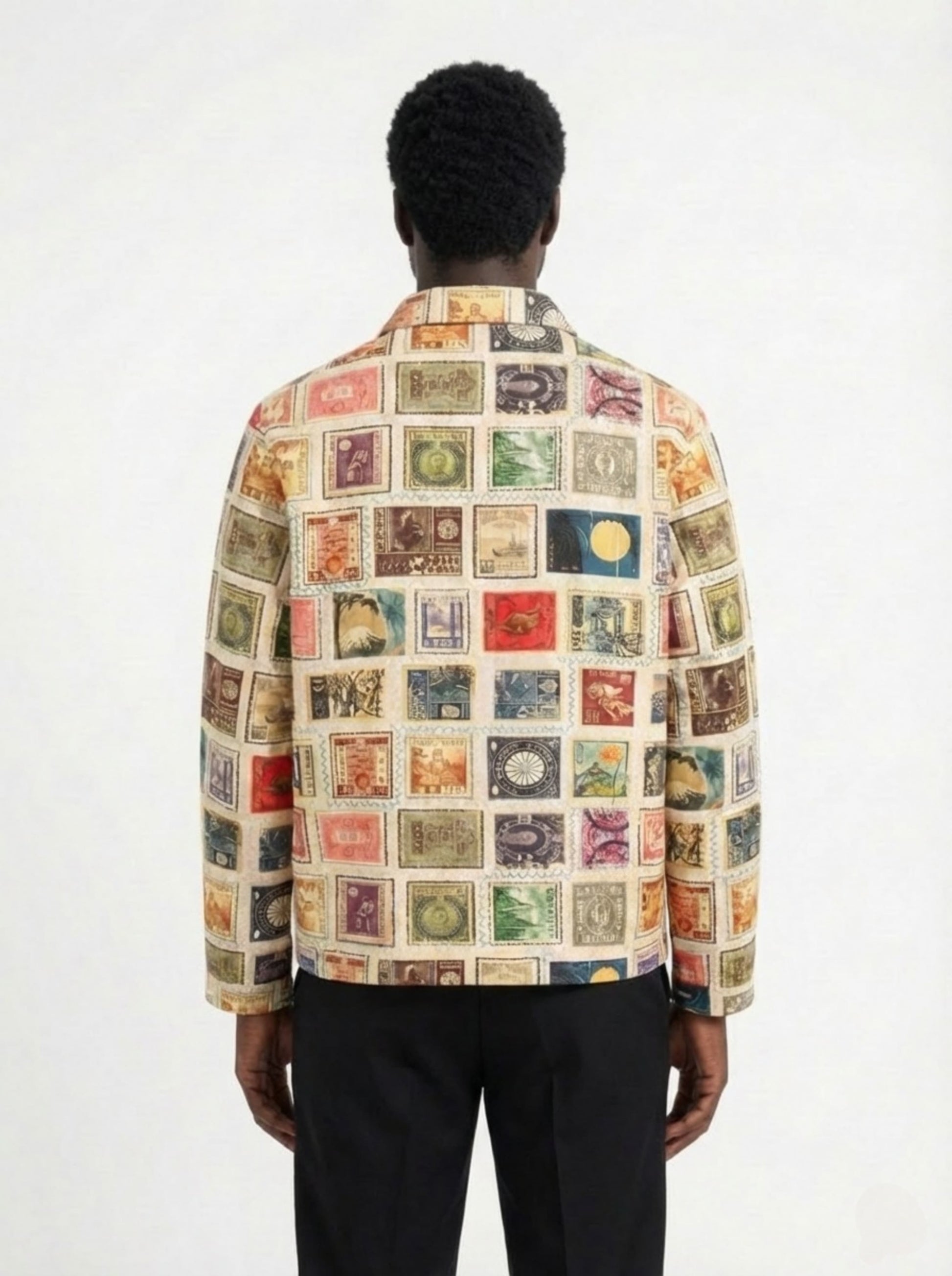 Person wearing a colorful patterned shirt with a white background